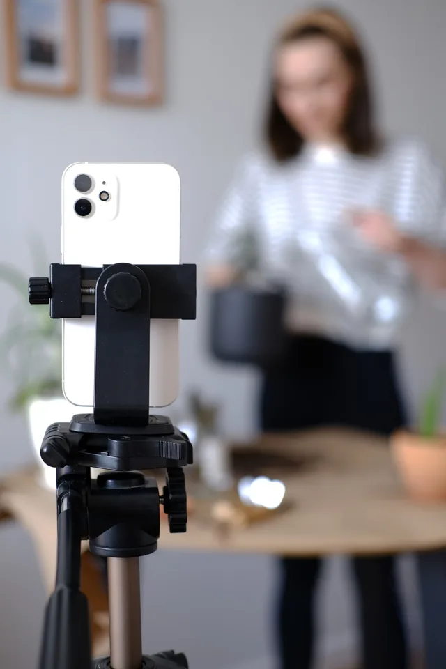 Phone on a tripod filming a creator