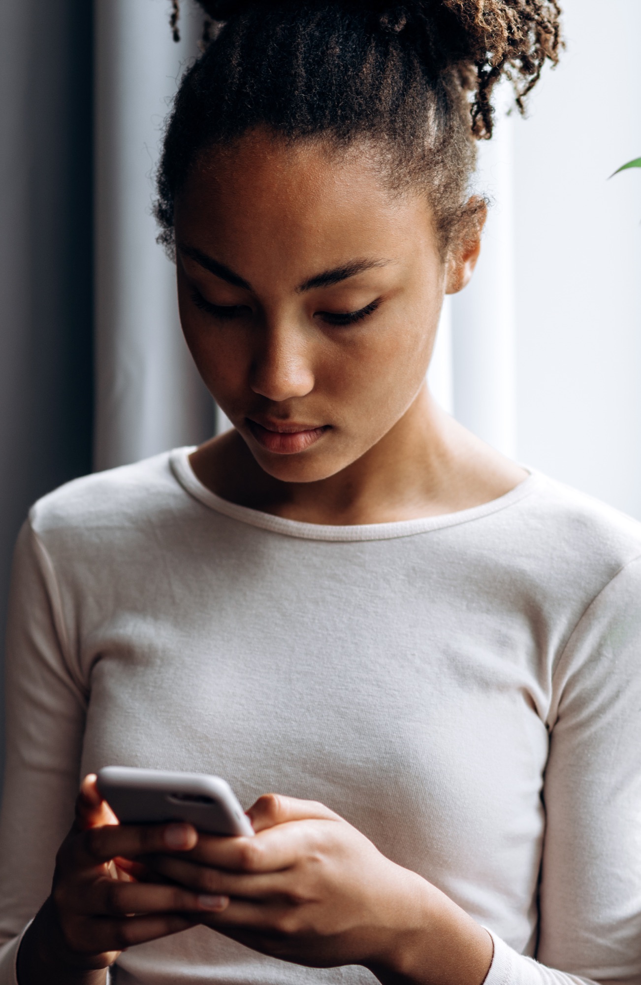 Creator reviewing content performance on a phone