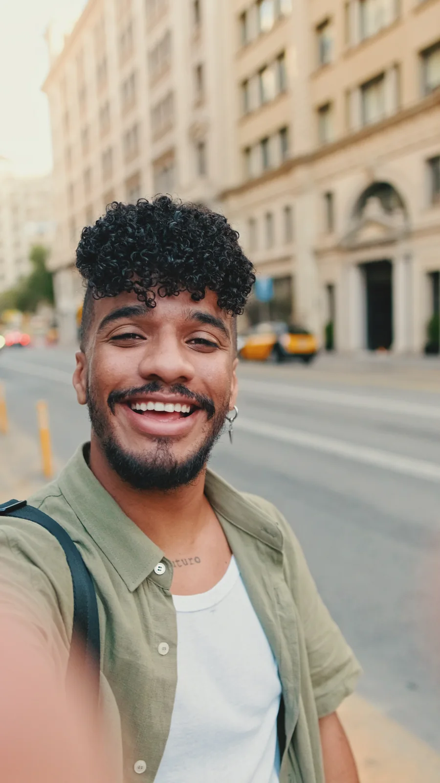 A smiling creator outdoors