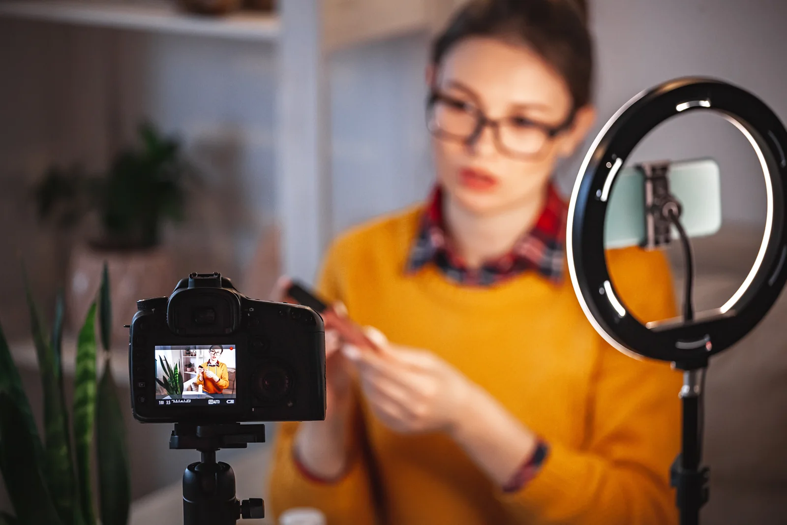 A beauty creator films a product review