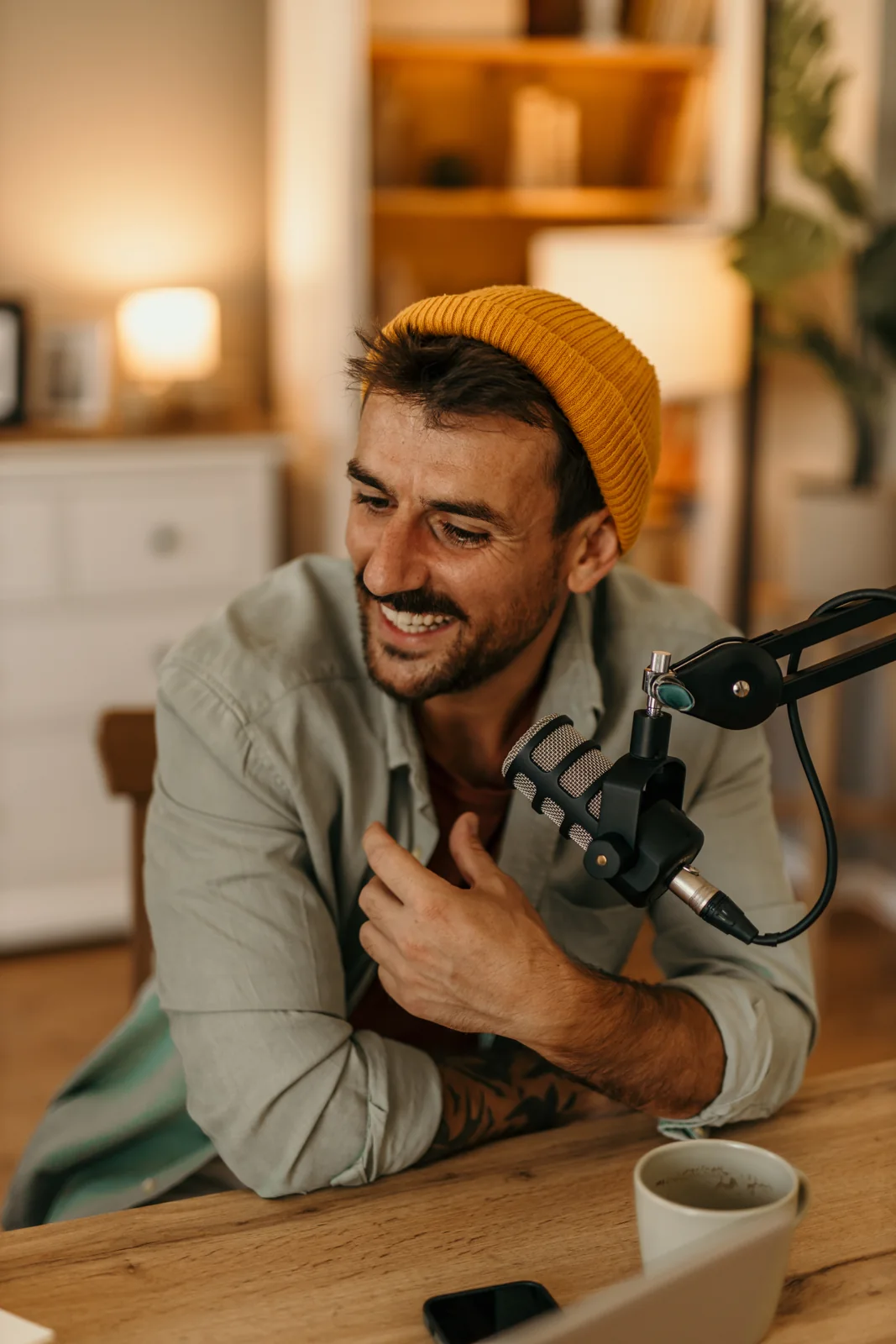 A smiling creator recording a podcast