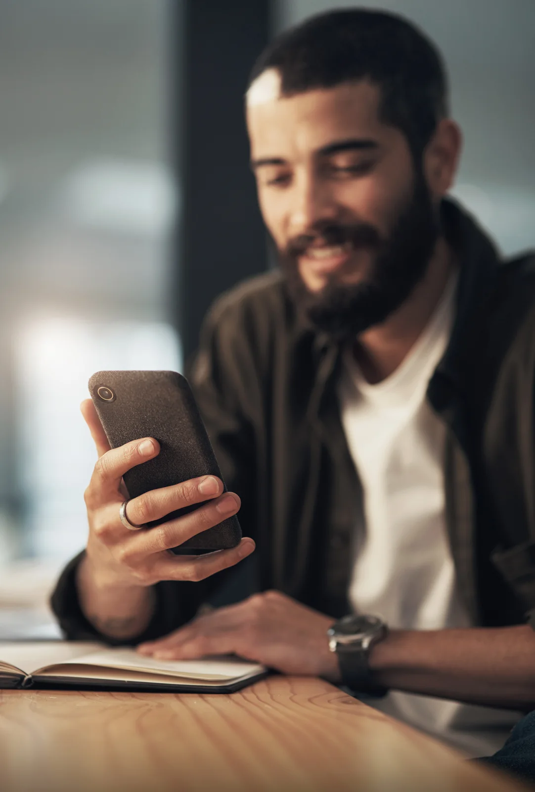 Business owner using his phone at a desk